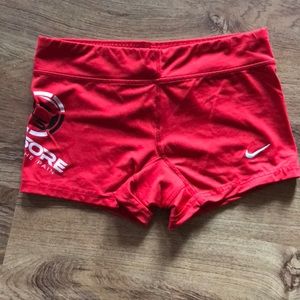 Red Nike workout shorts printed with Livesore logo